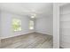 Well-lit bedroom with two windows, ceiling fan, and closet with wire shelving at 19 Pistachio Loop # G, Murrells Inlet, SC 29576