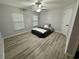 Cozy bedroom featuring two windows, ceiling fan, and comfortable bed with modern bedding at 19 Pistachio Loop # G, Murrells Inlet, SC 29576
