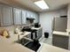 Kitchen featuring stainless steel appliances, gray cabinets, and subway backsplash at 19 Pistachio Loop # G, Murrells Inlet, SC 29576