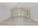 Bright, airy living room featuring vaulted ceiling, ceiling fan, and large windows at 19 Pistachio Loop # G, Murrells Inlet, SC 29576