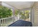 Screened porch with white railings and peaceful wooded view at 19 Pistachio Loop # G, Murrells Inlet, SC 29576