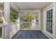 Relaxing screened porch with white railings overlooking lush greenery at 19 Pistachio Loop # G, Murrells Inlet, SC 29576
