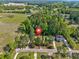 Aerial view of residential home surrounded by mature trees in neighborhood at 2939 King St., Loris, SC 29569