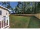 Backyard with privacy fence, partial view of deck and exterior at 2939 King St., Loris, SC 29569