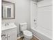 The bathroom includes a shower and tub combination and a neutral color palette at 2939 King St., Loris, SC 29569