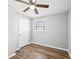 Bedroom features light gray walls, white door, and wood-look flooring at 2939 King St., Loris, SC 29569