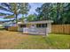 Charming home featuring a cozy front deck, green shutters, and a well-maintained lawn at 2939 King St., Loris, SC 29569