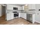 The kitchen features stainless steel appliances, white cabinets and granite countertops at 2939 King St., Loris, SC 29569