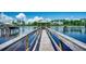 Picturesque wooden dock with gazebo overlooking serene lake, perfect for relaxation and enjoying waterfront views at 311 Las Olas Dr., Myrtle Beach, SC 29577