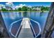 Waterfront dock featuring durable metal railing, providing a safe and secure access point to the tranquil lake at 311 Las Olas Dr., Myrtle Beach, SC 29577