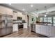 Spacious kitchen features stainless steel appliances, granite countertops, and an island with a sink at 311 Las Olas Dr., Myrtle Beach, SC 29577