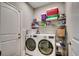 Well-organized laundry room features modern appliances and convenient shelving for ample storage and functionality at 311 Las Olas Dr., Myrtle Beach, SC 29577