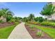 Inviting walkway through beautifully landscaped grounds with lush greenery and manicured flowerbeds, providing scenic views at 311 Las Olas Dr., Myrtle Beach, SC 29577