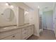Bathroom with double vanity, granite countertop, framed mirrors, and tiled walk-in shower at 4017 Chalmers Ct., Myrtle Beach, SC 29579