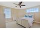 Bright bedroom with white furniture, ceiling fan, and lots of natural light at 4017 Chalmers Ct., Myrtle Beach, SC 29579
