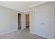 Bedroom with neutral walls, carpeted floors, and white closet and hall doors at 4017 Chalmers Ct., Myrtle Beach, SC 29579