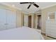 Well lit bedroom features a ceiling fan, and en suite bathroom at 4017 Chalmers Ct., Myrtle Beach, SC 29579