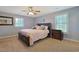 Bedroom featuring a dark wood bed frame, plush carpeting, and neutral gray walls at 4017 Chalmers Ct., Myrtle Beach, SC 29579