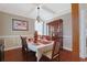 Formal dining room featuring a coffered ceiling, wood floors, and elegant furnishings at 4017 Chalmers Ct., Myrtle Beach, SC 29579