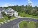 Aerial view of a well-maintained home with mature landscaping, a driveway, and a two-car garage at 4017 Chalmers Ct., Myrtle Beach, SC 29579