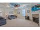 Comfortable living room featuring a fireplace, coffered ceiling, and ample natural light at 4017 Chalmers Ct., Myrtle Beach, SC 29579