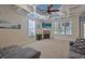 Inviting living room with a fireplace, detailed ceiling, and large windows for natural light at 4017 Chalmers Ct., Myrtle Beach, SC 29579