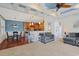 Spacious open-concept living space with high coffered ceilings, carpet, and stylish furniture at 4017 Chalmers Ct., Myrtle Beach, SC 29579