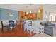 Open living space with a breakfast bar, wood floors, and stylish decor at 4017 Chalmers Ct., Myrtle Beach, SC 29579