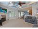 Bright living space with a fireplace, large windows, and open access to the kitchen at 4017 Chalmers Ct., Myrtle Beach, SC 29579