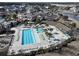 Aerial view of community pool with lap lanes, a hot tub, a lazy river, and ample seating at 4017 Chalmers Ct., Myrtle Beach, SC 29579