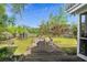 Expansive backyard featuring a wooden deck with seating, creating an inviting outdoor living space at 7 Pine Valley Ln., Surfside Beach, SC 29575
