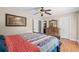 Bedroom with wood floors and wood furniture, with a painting of a landscape above the bed at 7 Pine Valley Ln., Surfside Beach, SC 29575