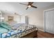 Spacious bedroom with a ceiling fan, wood floors, and closet doors at 7 Pine Valley Ln., Surfside Beach, SC 29575