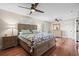 Spacious bedroom with a ceiling fan, wood floors, and wood furniture at 7 Pine Valley Ln., Surfside Beach, SC 29575