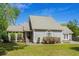 Charming home featuring a well-manicured lawn, welcoming front entrance, and beautiful landscaping at 7 Pine Valley Ln., Surfside Beach, SC 29575