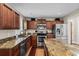 Well-appointed kitchen featuring stainless steel appliances, custom cabinets, granite counters, and a functional island at 7 Pine Valley Ln., Surfside Beach, SC 29575