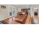 Open kitchen and dining area featuring hardwood floors, stainless steel appliances, and ample natural light at 7 Pine Valley Ln., Surfside Beach, SC 29575