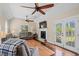 Cozy living room with hardwood floors, fireplace, comfortable seating, and access to the backyard at 7 Pine Valley Ln., Surfside Beach, SC 29575