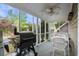 Relaxing screened-in porch with outdoor furniture, perfect for enjoying fresh air and serene views at 7 Pine Valley Ln., Surfside Beach, SC 29575