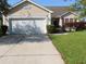 Charming single-story home with attached garage, mature landscaping, and inviting curb appeal at 819 Brookline Dr., Myrtle Beach, SC 29579