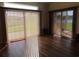 Bright living room with big windows, hardwood floors, and views of the backyard at 819 Brookline Dr., Myrtle Beach, SC 29579