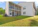 Spacious, private backyard featuring a screened-in porch and well-maintained lawn at 820 Fairway Dr. # 1506Hh, Longs, SC 29568