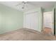 Bedroom featuring neutral carpet, a ceiling fan, and a double door closet at 820 Fairway Dr. # 1506Hh, Longs, SC 29568