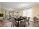 Stylishly decorated dining area with modern furniture and an open view to the living room and outdoor space at 820 Fairway Dr. # 1506Hh, Longs, SC 29568