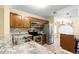 Updated kitchen featuring stainless steel appliances, granite countertops, and wooden cabinets at 820 Fairway Dr. # 1506Hh, Longs, SC 29568