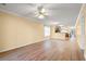Open living room with wood flooring, seamlessly connected to the kitchen and dining areas at 820 Fairway Dr. # 1506Hh, Longs, SC 29568
