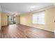 Bright living room with sliding glass doors to the outdoor space and modern wood-look flooring at 820 Fairway Dr. # 1506Hh, Longs, SC 29568