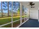 Screened porch with ceiling fan and views of the lawn and surrounding trees at 820 Fairway Dr. # 1506Hh, Longs, SC 29568