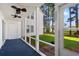 Screened porch with ceiling fan and views of the lawn and surrounding trees at 820 Fairway Dr. # 1506Hh, Longs, SC 29568