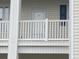 This image shows a closer view of a balcony entrance with white railings and blue shutters at 901-9 West Port Dr. # 907, North Myrtle Beach, SC 29582